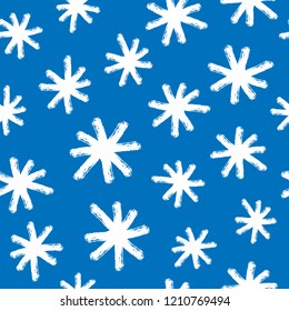 Print with snowflakes drawn by hand with rough brush. Winter seamless pattern. Grunge, sketch, watercolor, graffiti. Vector illustration.