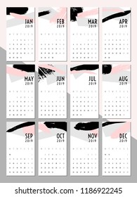 Printable 2019 calendar template. Abstract design with textured brush strokes in black, gray and pastel pink. Minimalist and modern twelve month calendar design.