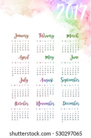 Printable calendar 2017 design with hand written calligraphic months on watercolor rainbow textures paint. Vector illustration