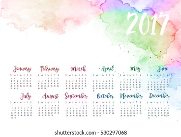 Printable calendar 2017 design with hand written calligraphic months on watercolor rainbow textures paint. Vector illustration