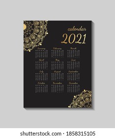 Printable luxury A4 2021 calendar design with vintage mandala in black background.Calendar design with ornamental golden mandala