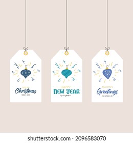 Printable template of greetings labels with doodle christmas balls for gifts and wishes. Festive handwritten toys orange, red and purple colors on blue background.