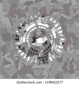 printer icon inside grey camouflaged emblem
