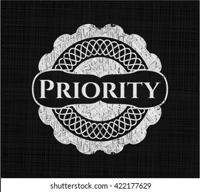 Priority chalkboard emblem on black board