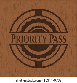 Priority Pass badge with wood background