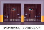 Prison corridor with two empty single cells behind steel bars cartoon vector. Jail facility interior with bunk bed, toilet bowl, washbasin and cell number on doors illustration. Imprisonment place
