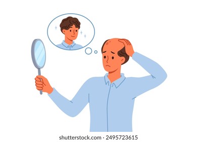 Problem of baldness in man looking in mirror and remembering presence of beautiful hair. Guy suffers from baldness due to poor genetics or insufficient intake of vitamins for body.