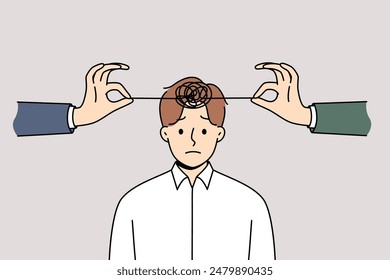 Problems with psychological health in man with tangled threads on head and hands of friends trying to untangle lump. Psychological disorder and insanity in business guy in need of psychotherapist