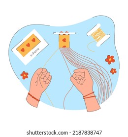 Process of weaving of DIY friendship bracelet. Hands make a wristband from threads according to the scheme