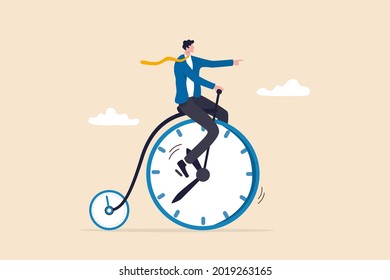 Productivity or efficiency spending time to finish work, time management or work life balance concept, businessman riding vintage bicycle with front wheel as clock and small wheel as stopwatch timer.