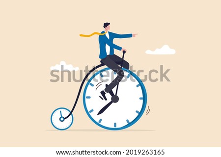 Productivity or efficiency spending time to finish work, time management or work life balance concept, businessman riding vintage bicycle with front wheel as clock and small wheel as stopwatch timer.