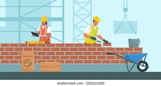 Professional builders laying bricks and checking brickwork