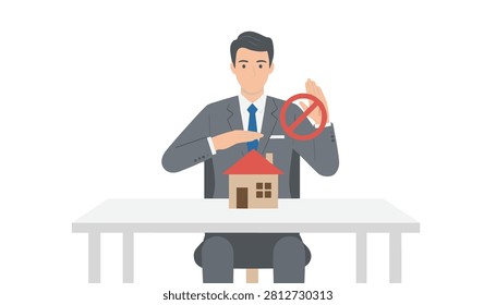 Professional businessman sitting at table gesturing to stop over a small house model.
