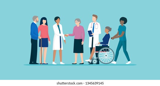 Professional caregivers and doctors meeting and supporting senior citizens and their families, senior care and medical assistance concept