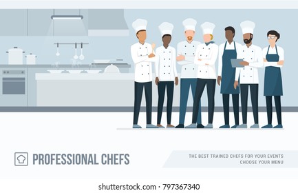 Professional chefs standing together in the restaurant's kitchen