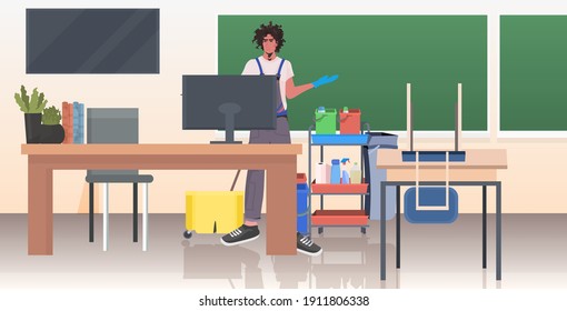 professional cleaner male janitor cleaning and disinfecting floor to prevent coronavirus pandemic modern school classroom interior horizontal full length vector illustration