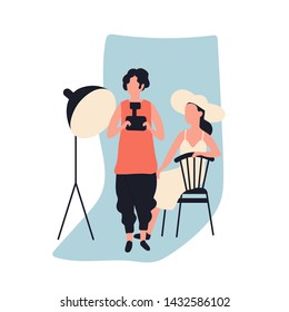 Professional female photographer holding photo camera and model at photographic studio full of photography equipment. Cute young woman and her creative hobby. Flat cartoon vector illustration.