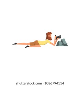 Professional male photographer paparazzi with camera taking pictures, spy hiding behind stone vector Illustration on a white background