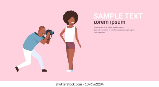 professional man photographer using camera shooting african american sexy woman model girl posing modern photo studio horizontal full length copy space