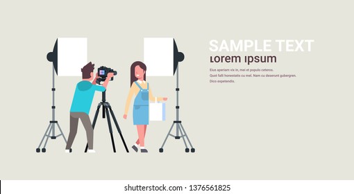 professional man photographer using dslr camera on tripod shooting beautiful woman model girl posing modern photo studio horizontal full length copy space
