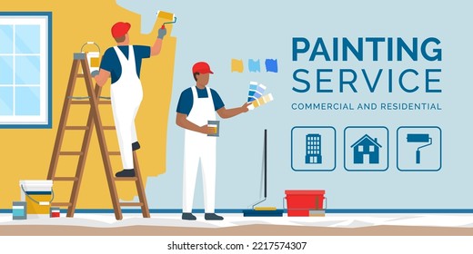 Professional painters and decorators painting walls in a residential room with professional equipment