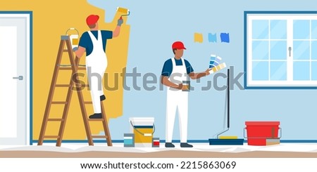 Professional painters and decorators painting walls in a residential room with professional equipment Imagine de stoc © 