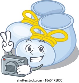 a professional photographer baby boy boots cartoon picture working with camera