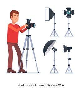 Professional photographer with camera on a tripod and photo studio lighting equipment. Flat style vector illustration isolated on white background.