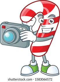 a professional Photographer christmas candy cane cartoon character with a camera