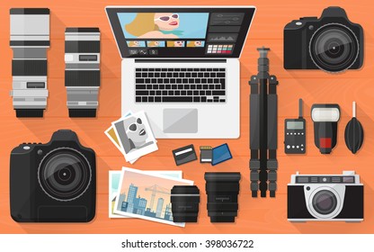 Professional photographer equipment on a desk, shooting and photo editing concept, flat lay