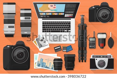 Professional photographer equipment on a desk, shooting and photo editing concept, flat lay