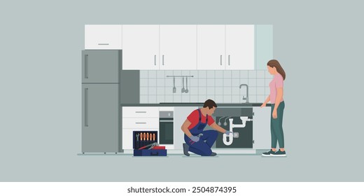 Professional plumber fixing a kitchen sink drain and woman standing next to him, professional plumbing service