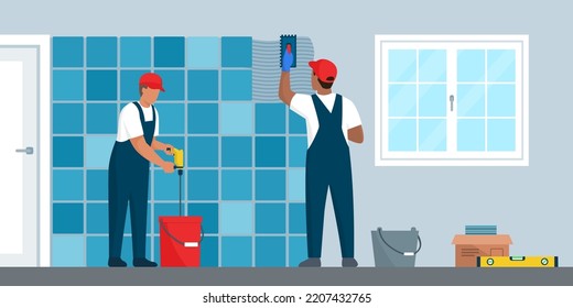 Professional tilers installing tiles on a wall using professional tools, home renovation concept