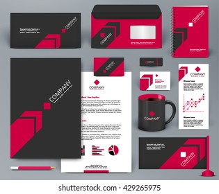 Kit de diseño profesional universal con flecha roja sobre fondo negro.Plantilla de identidad corporativa.  Diseño de fondo de negocios con insignia, carpeta, taza, pendiente, carta. 