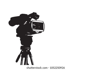 Professional video camera set on a tripod isolated on white background.