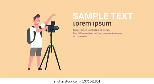professional videographer using camera on tripod man shooting video on steady cam horizontal full length flat copy space