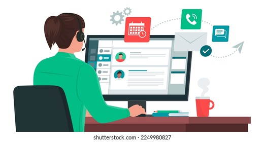 Professional virtual assistant sitting at desk and working with computer: she is talking with customers, replying to messages and planning