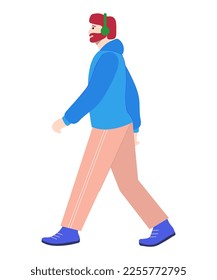 Profile of a walking man in green headphones