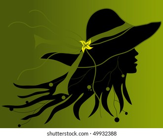 Profile of woman's face with a hat on green background