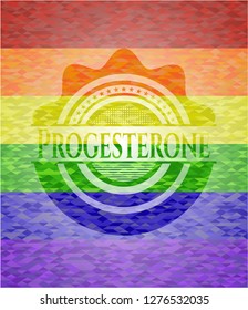 Progesterone emblem on mosaic background with the colors of the LGBT flag