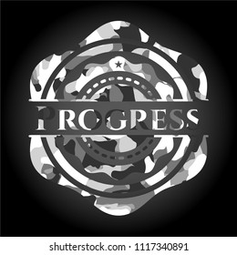 Progress written on a grey camouflage texture