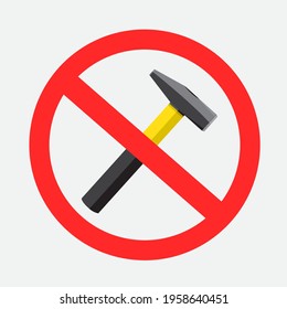 Prohibited color hammer knocking pounding beating loudly sign on gray background. Buzz and scream from hammers is forbidden