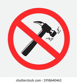 Prohibited sign hammer knocking pounding beating loudly silhouette on gray background. Buzz and scream from hammers is forbidden