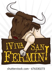 Promotional poster with bull winking at you over a wooden greeting sign for Festival of San Fermin (written in Spanish).