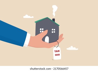 Property tax, real estate or housing payment, money or bills to pay for government concept, businessman hand holding house with the price tags showing property tax with dollar signs to pay for.