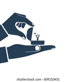 Proposal marriage silhouette, vector illustration minimal flat design. Man is holding in hand an open box with a wedding ring and diamond. Pictogram isolated black icon on white background.