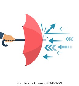 Protected from attack, concept. Defender business metaphor. Financial security. Businessman is holding an umbrella as a shield reflecting the attacks.