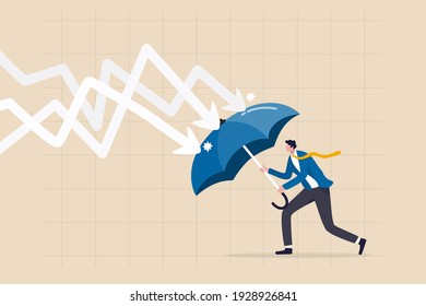 Protection or defensive stock in economy crisis or market crash, business resilient to survive difficulty or insurance concept, businessman holding umbrella to cover and protect from downturn arrow.