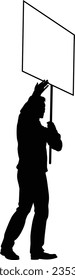 Protestor or demonstrator at a demonstration march, picket line or strike protest rally in silhouette. Holding up a banner or picket sign board placard.