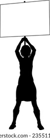 Protestor or demonstrator at a demonstration march, picket line or strike protest rally in silhouette. Holding up a banner or picket sign board placard.